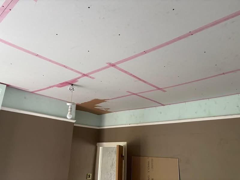 Ceiling before plastering repair, showing water damage